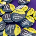Close up of a button that says 'I'm a dementia friend'